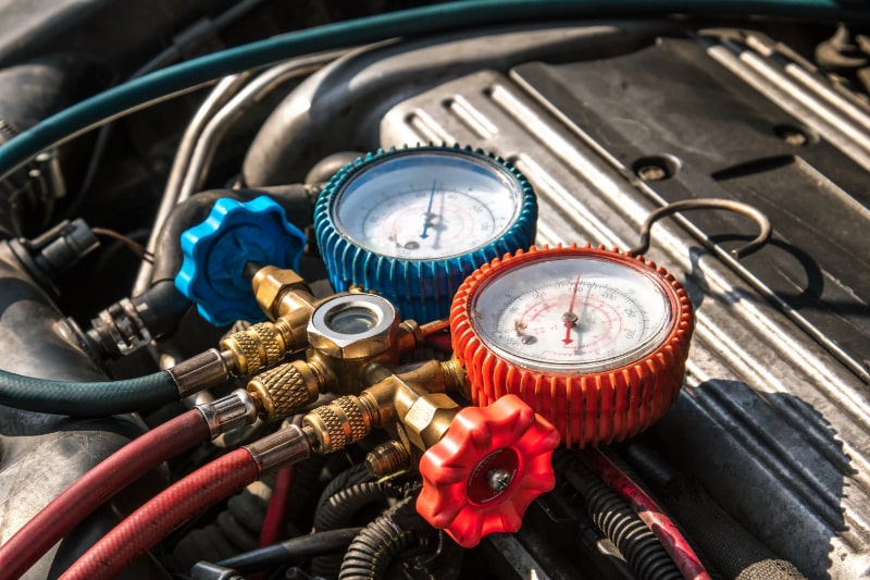 Mechanic Fixing Car Air Condition