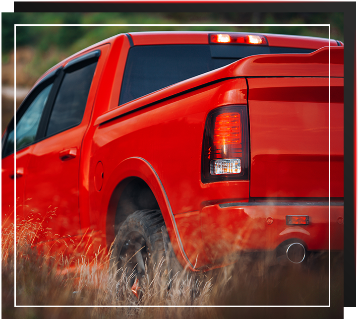 Modern pickup in the middle of the desert. Car at the offroad. Big red truck stopped at the during off-road trip