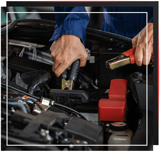 Mechanic Fixing Car Battery