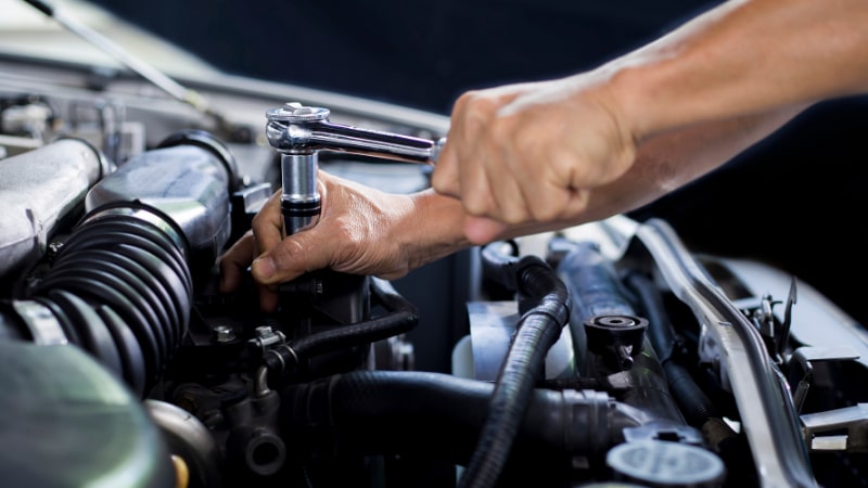 Mechanic Fixing Car Engines